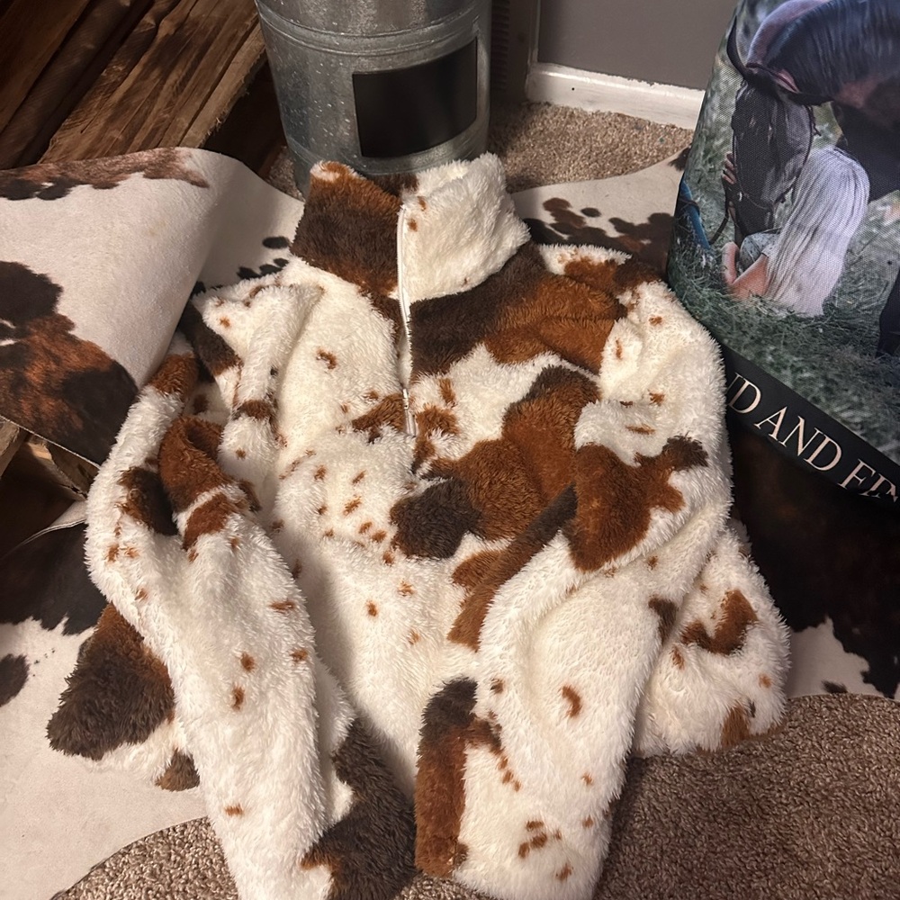 Brand new cow print quarter zip
